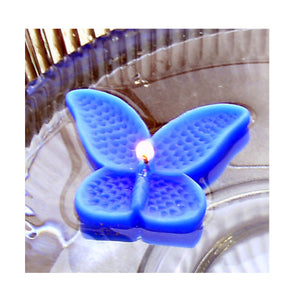 set of eight blue butterfly shaped floating wedding candles for reception centerpieces