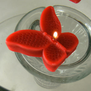 set of eight red butterfly shaped floating wedding candles for reception centerpieces