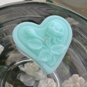 spa blue floating heart candle with rose motif for wedding reception centerpieces