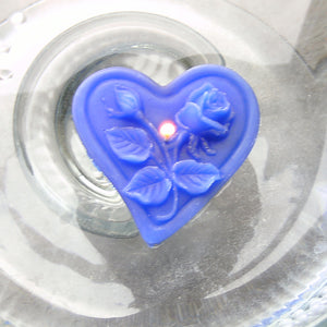 blue floating heart candle with rose motif for wedding reception centerpieces