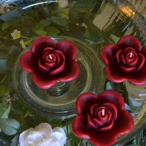 burgundy deep red colored rose shaped floating candle for wedding reception centerpieces