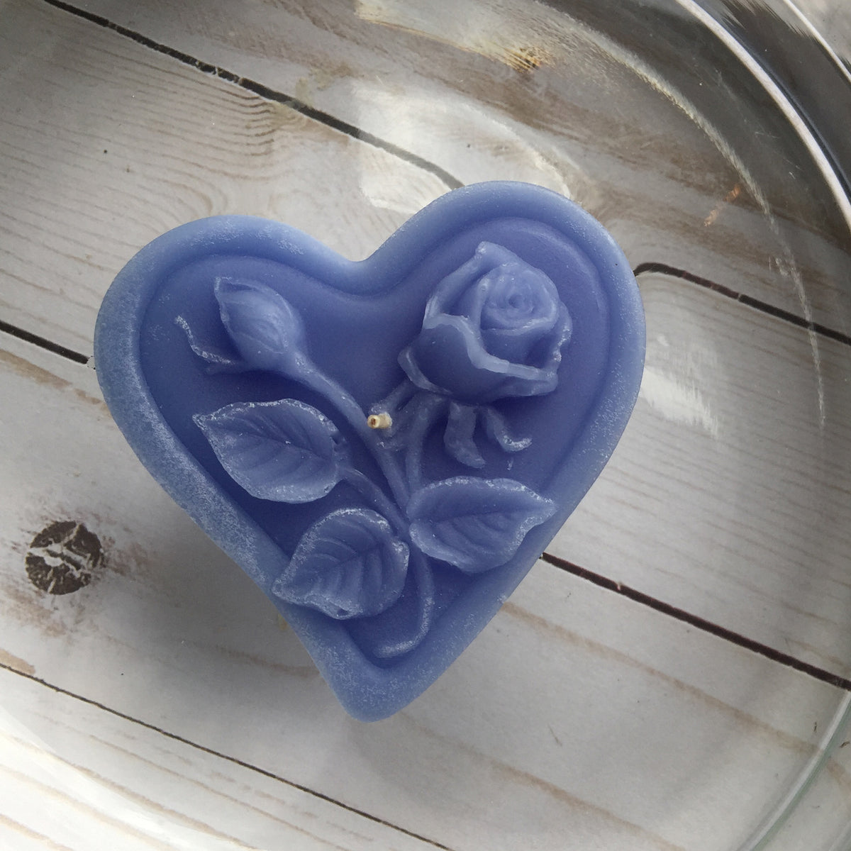 dusty blue floating heart candle with rose motif for wedding reception centerpieces