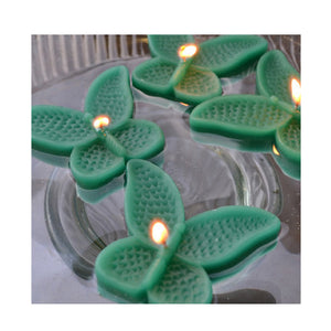 set of eight emerald green butterfly shaped floating wedding candles for reception centerpieces