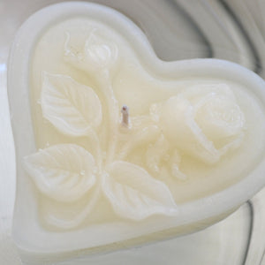 ivory cream floating heart candle with rose motif for wedding reception centerpieces