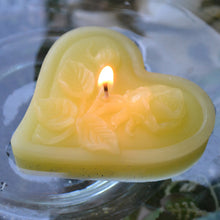 Load image into Gallery viewer, light yellow floating heart candle with rose motif for wedding reception centerpieces