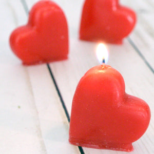 set of four mini red heart candles for valentines day, birthdays, cupcake topper