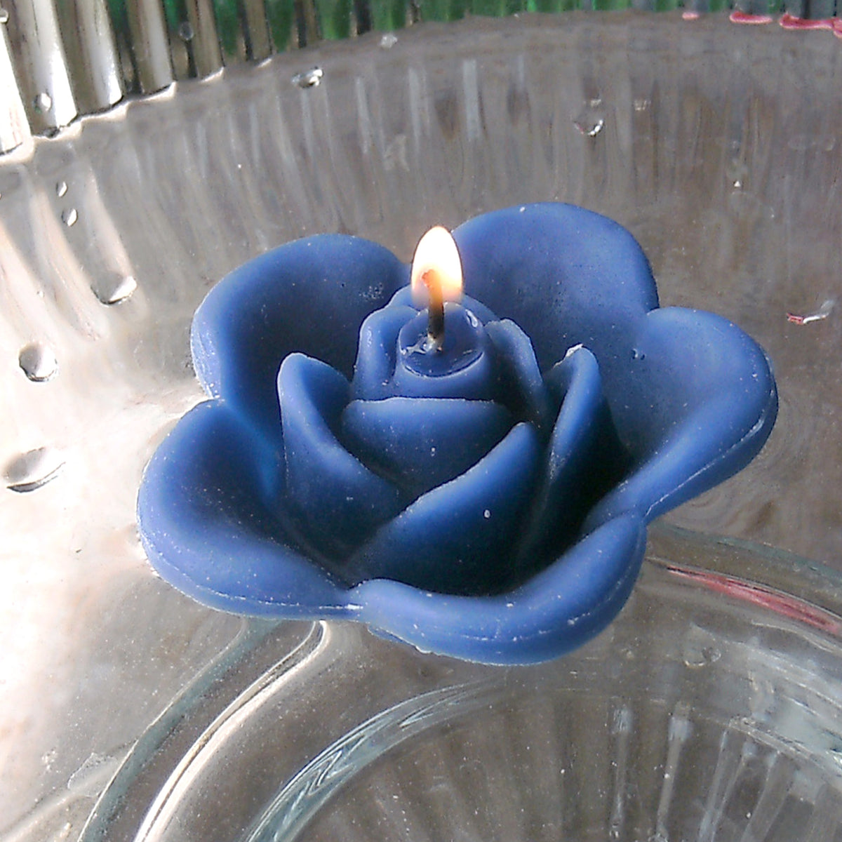 navy marine blue colored rose shaped floating candle for wedding reception centerpieces