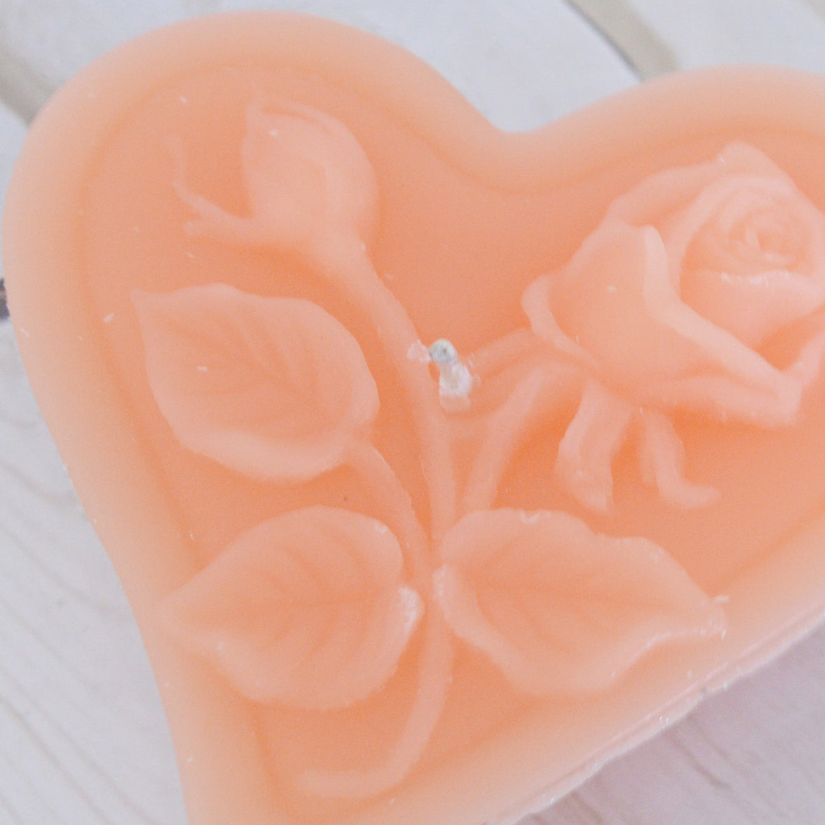 peach floating heart candle with rose motif for wedding reception centerpieces