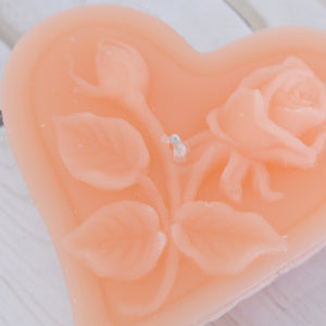 peach floating heart candle with rose motif for wedding reception centerpieces
