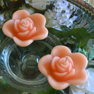 peach colored rose shaped floating candle for wedding reception centerpieces