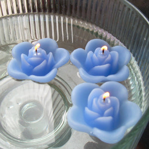 periwinkle blue colored rose shaped floating candle for wedding reception centerpieces