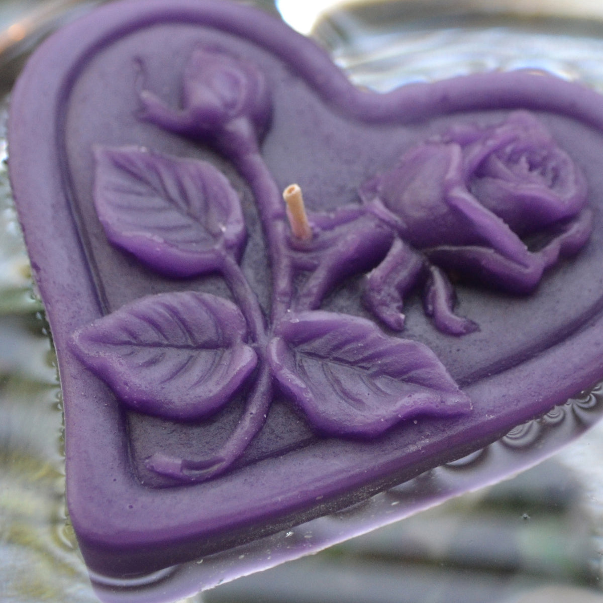 purple floating heart candle with rose motif for wedding reception centerpieces