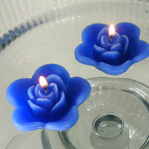 royal blue colored rose shaped floating candle for wedding reception centerpieces