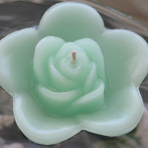 seafoam green colored rose shaped floating candle for wedding reception centerpieces