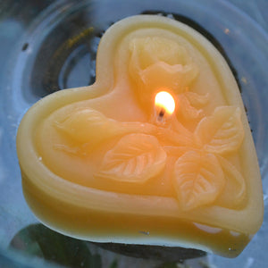 Sun yellow floating heart candle with rose motif for wedding reception centerpieces