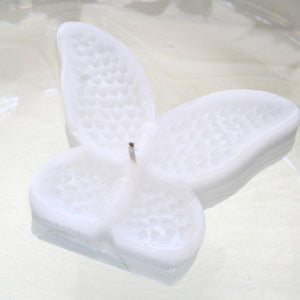 set of eight white butterfly shaped floating wedding candles for reception centerpieces